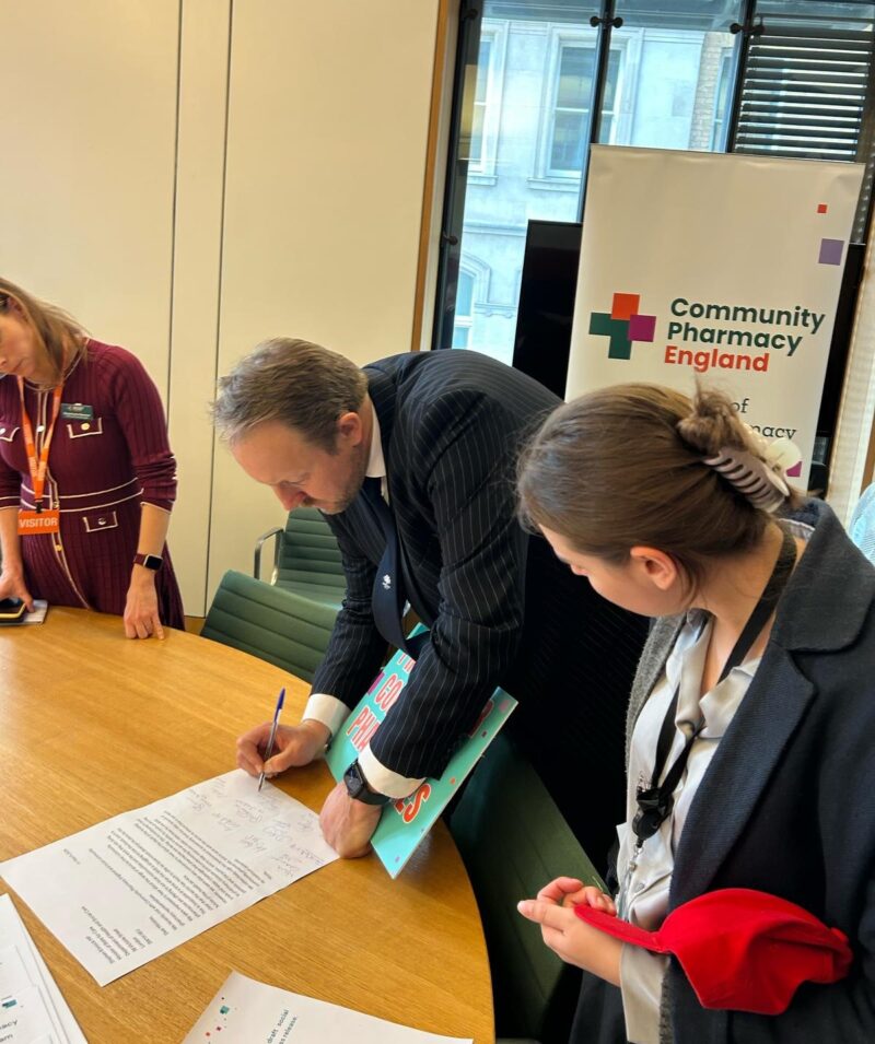 Toby signing a joint letter to the government calling for more support for local pharmacies