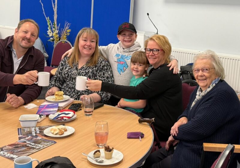 Toby with staff and local residents at the Salvation Army coffee morning