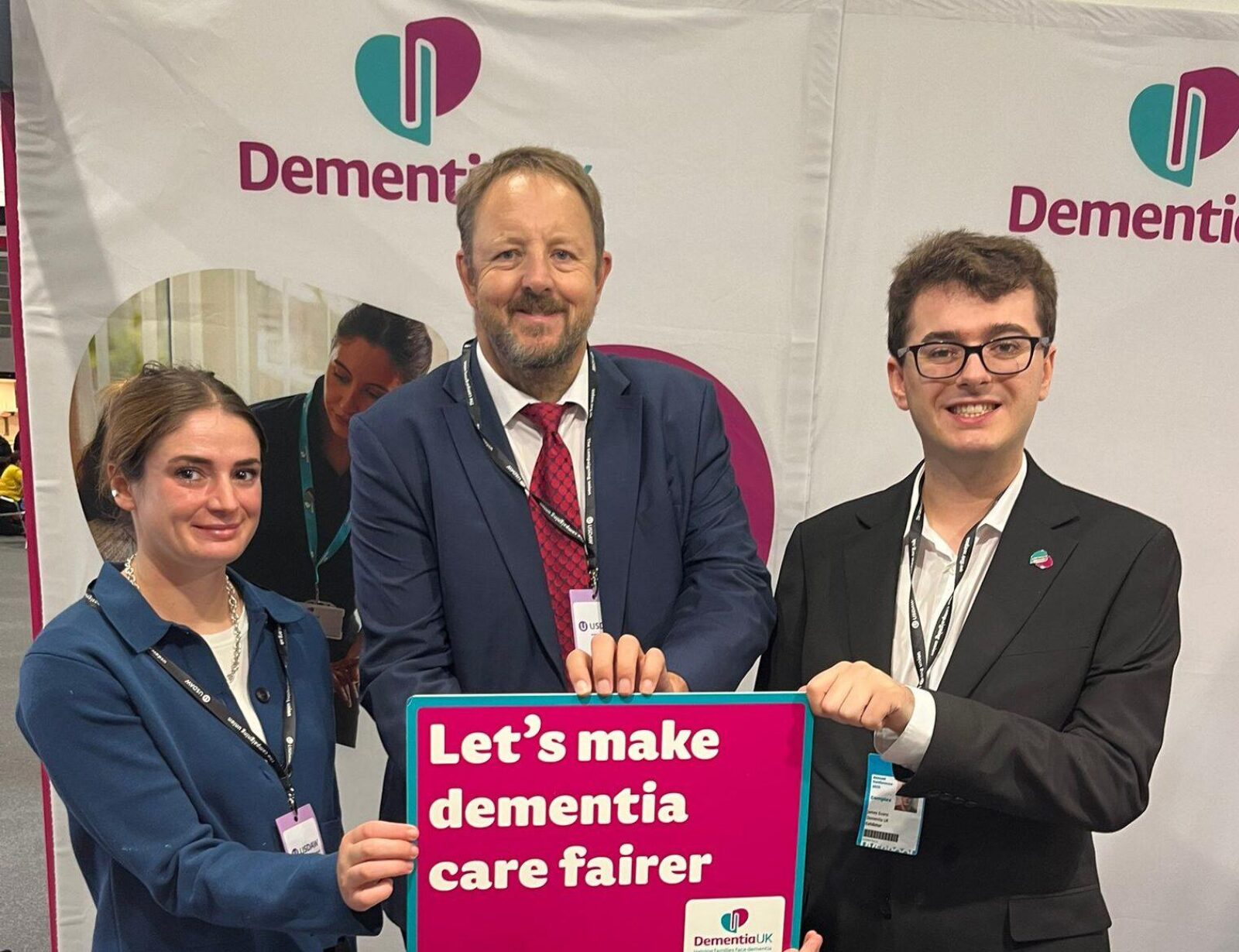 Toby Perkins MP with two campaigners from Dementia UK, holding a sign that reads 