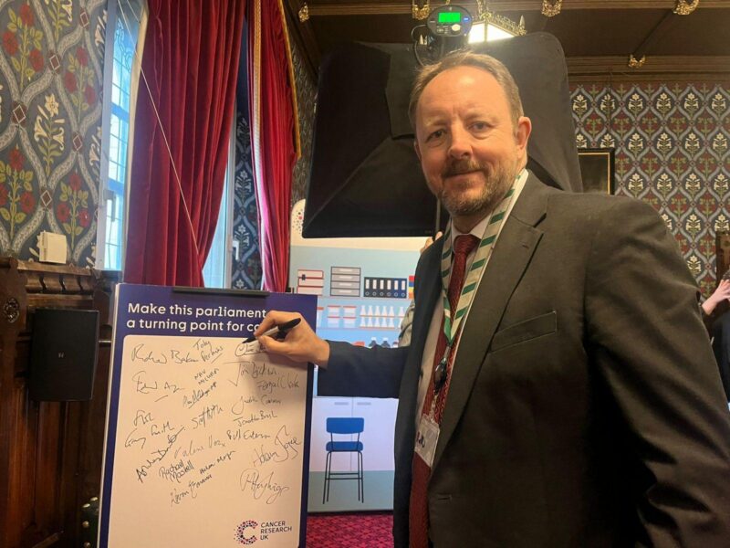 Toby signing the pledge to